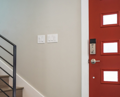 red door and stairs with wooden steps and metal handrail home inspectors jacksonville fl