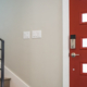 red door and stairs with wooden steps and metal handrail home inspectors jacksonville fl