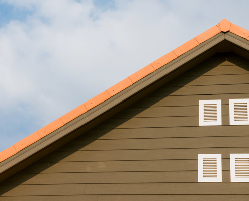home inspectors jacksonville fl home with orange roof and brown siding